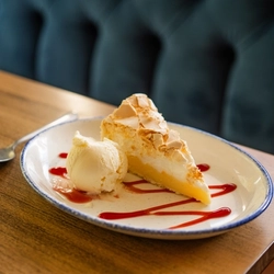 A served dessert of Lemon Meringue Pie available at Hungry Horse venues.